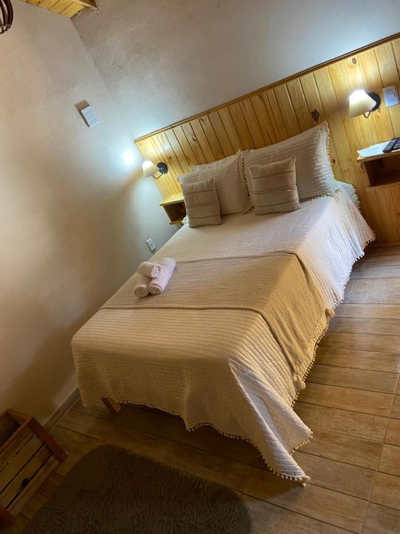 Postel nebo postele na pokoji v ubytování Chalés Campo Verde