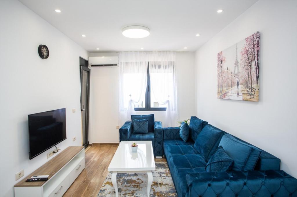 TV a/nebo společenská místnost v ubytování Apartments NIKOS FAMILY