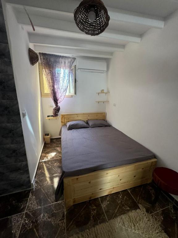 Postel nebo postele na pokoji v ubytování Shahenda House