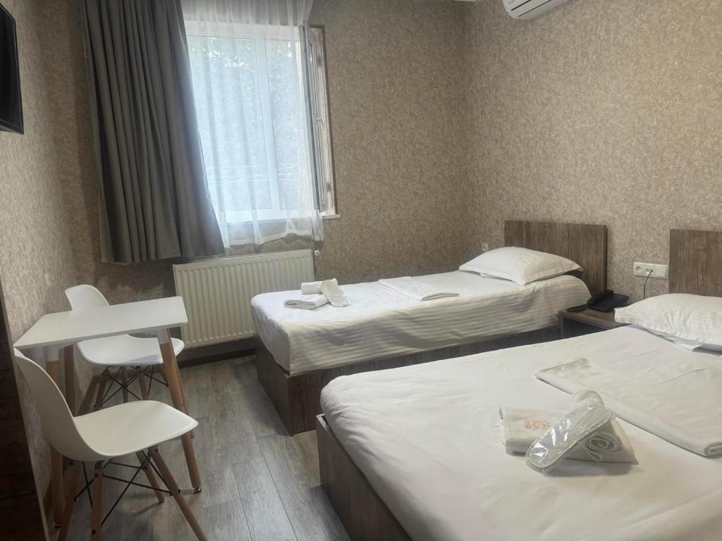 Postel nebo postele na pokoji v ubytování Hotel Skib