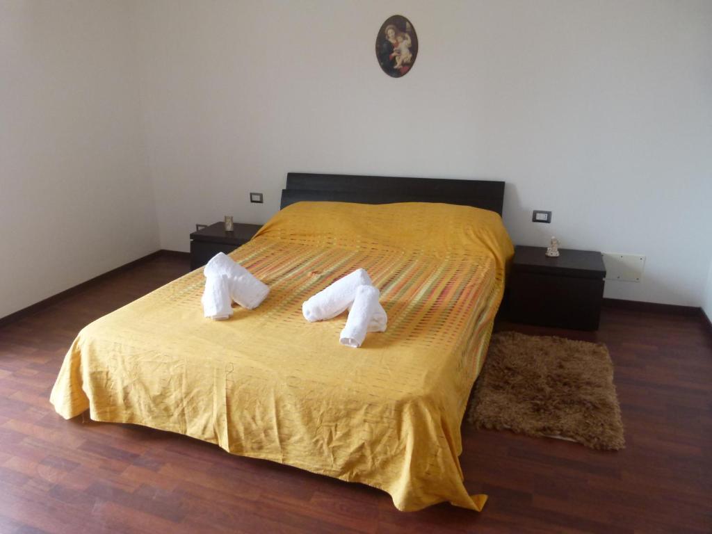 Ένα ή περισσότερα κρεβάτια σε δωμάτιο στο Villa Aurora Appartamento in villa con piscina