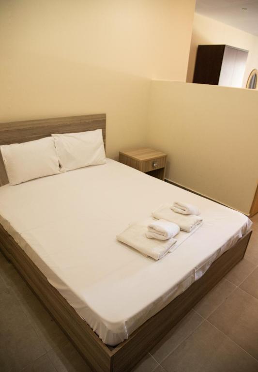 Postel nebo postele na pokoji v ubytování Sunset Inn