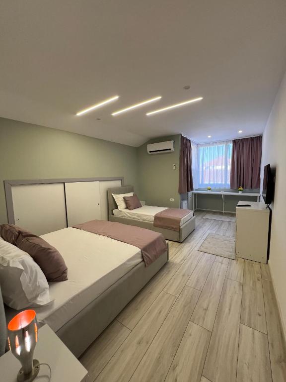 Postel nebo postele na pokoji v ubytování Coral Home