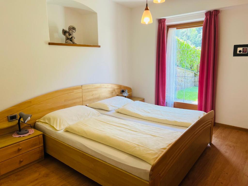 Postel nebo postele na pokoji v ubytování Apartments Bernard