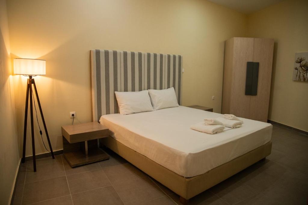 Postel nebo postele na pokoji v ubytování Sunset Inn