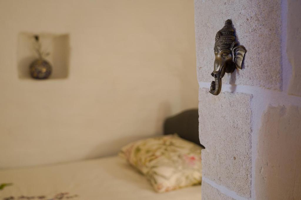 Postel nebo postele na pokoji v ubytování Trulli Oiseaux Migrateurs