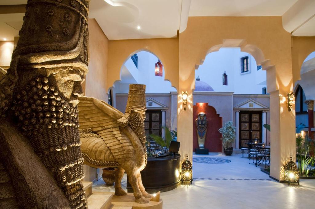 a statue of an elephant in the lobby of a building at Le Temple Des Arts in Ouarzazate