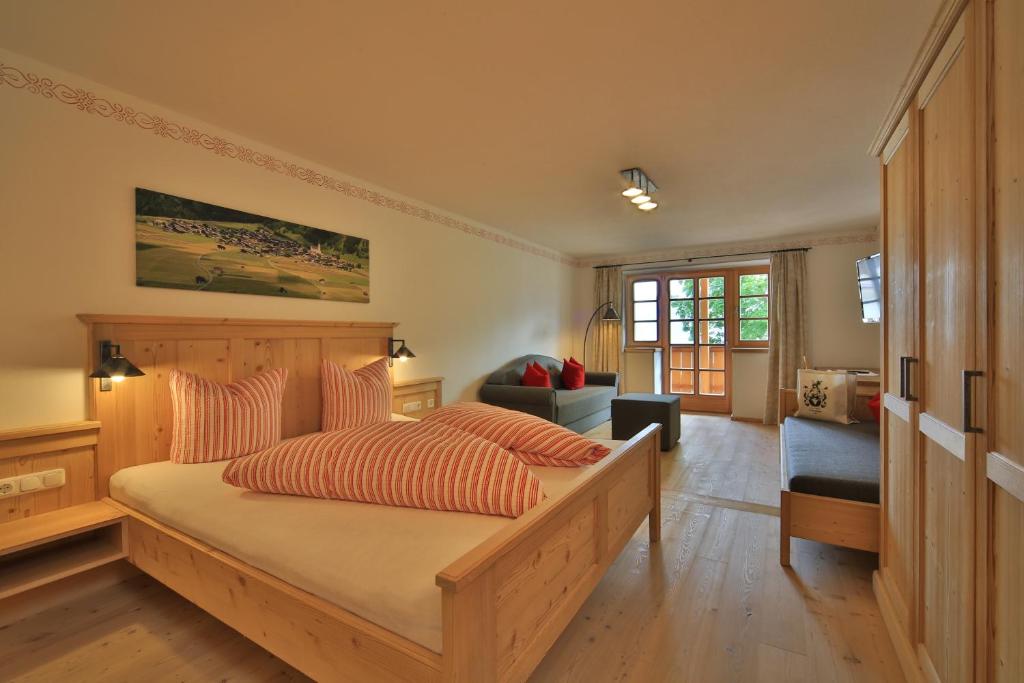 Postel nebo postele na pokoji v ubytování Hotel Gasthof Unterwöger