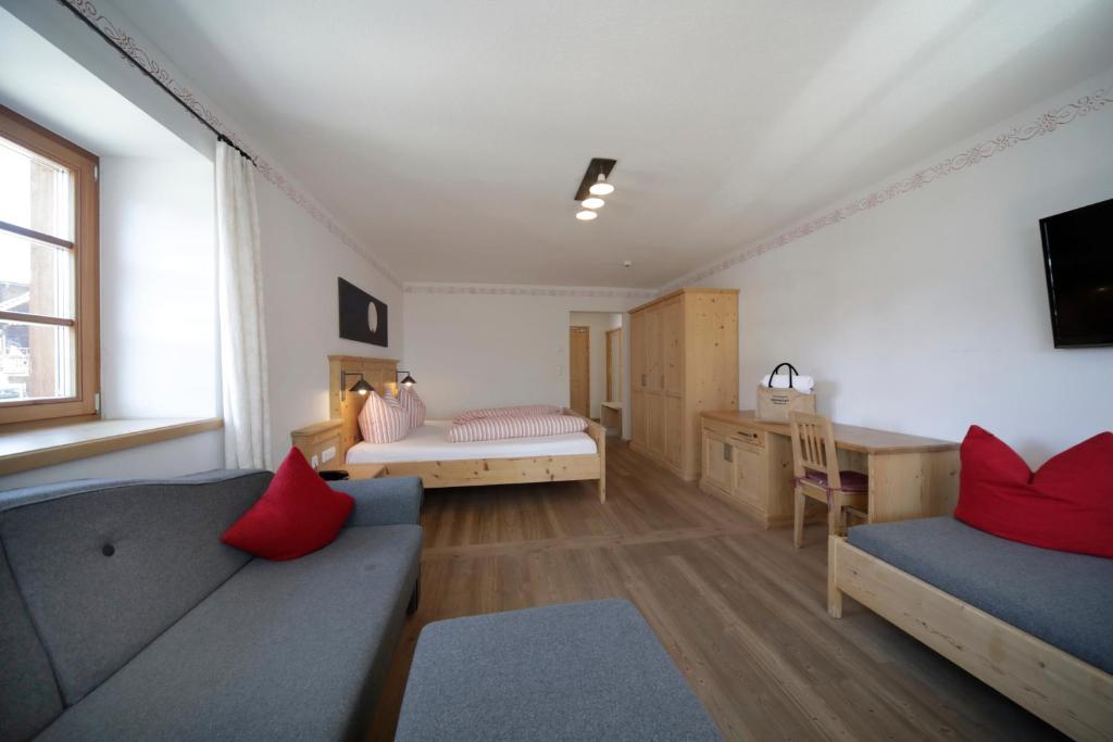 Postel nebo postele na pokoji v ubytování Hotel Gasthof Unterwöger