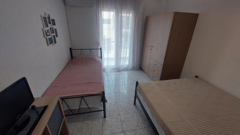 Postel nebo postele na pokoji v ubytování Makis Apartments Flogita
