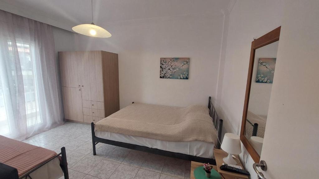 Postel nebo postele na pokoji v ubytování Makis Apartments Flogita