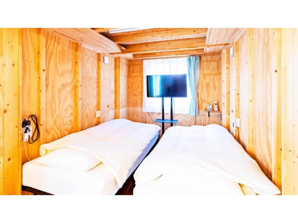 Un pat sau paturi într-o cameră la Mobilita Court Iwate - Vacation STAY 13738v
