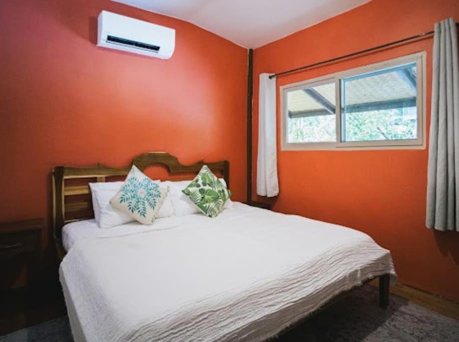Postel nebo postele na pokoji v ubytování Malaya House