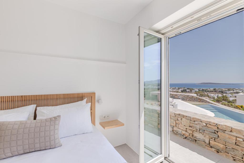 Postel nebo postele na pokoji v ubytování Melora Villas Paros