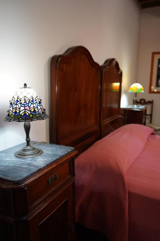 A bed or beds in a room at Le Gorghe di Valmarino