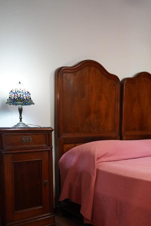 A bed or beds in a room at Le Gorghe di Valmarino