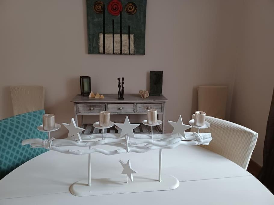 a white table with stars and candles on it at El Marques 28 by emepas in Logroño