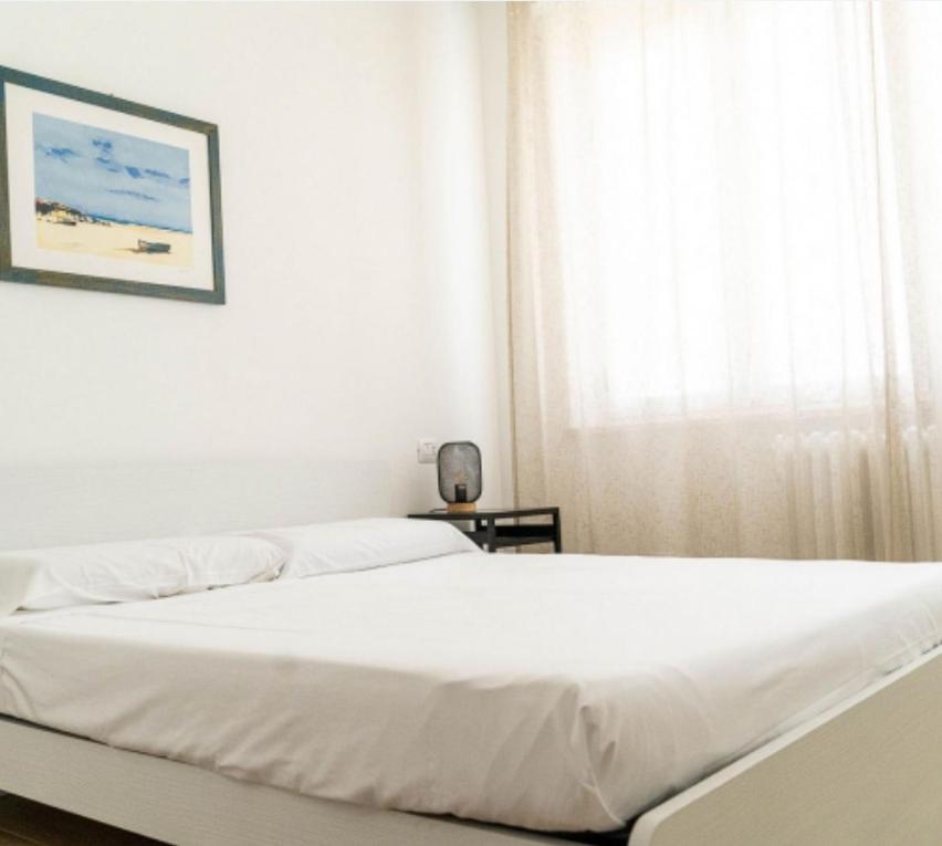 Postel nebo postele na pokoji v ubytování La Cicala del Conero