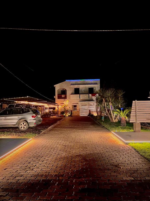 a car parked in front of a building at night at Villa Latino in Vieste