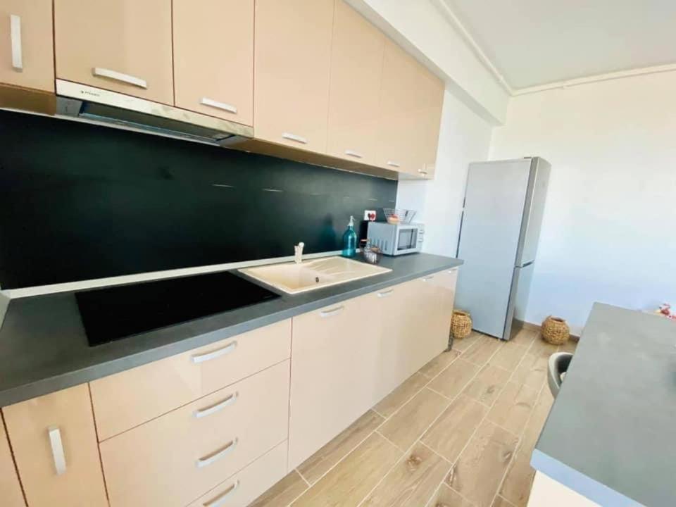 Kuchyň nebo kuchyňský kout v ubytování Bliss Apart Hotel Sea View