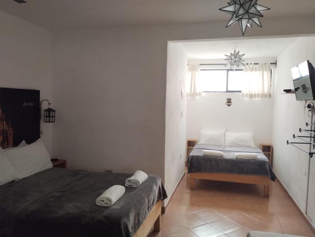 Postel nebo postele na pokoji v ubytování La Catrina Hostel