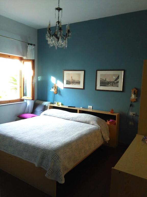 Postel nebo postele na pokoji v ubytování Albergo Villa Sorriso