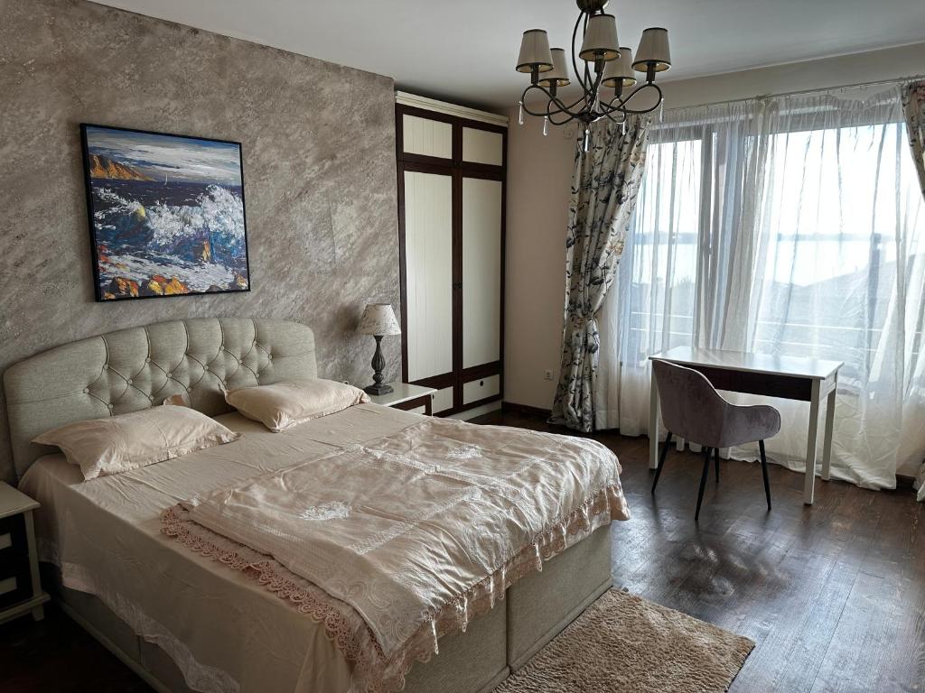 A bed or beds in a room at Sozopolis Cliffs Luxury Seaview Villa