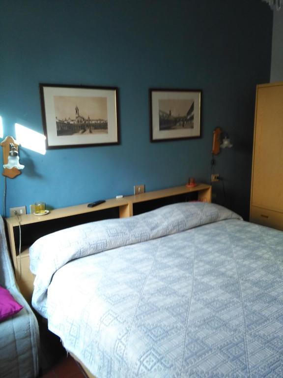 Postel nebo postele na pokoji v ubytování Albergo Villa Sorriso