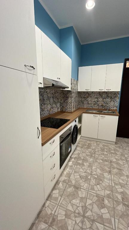 Kuchyň nebo kuchyňský kout v ubytování Domus Arco Romano
