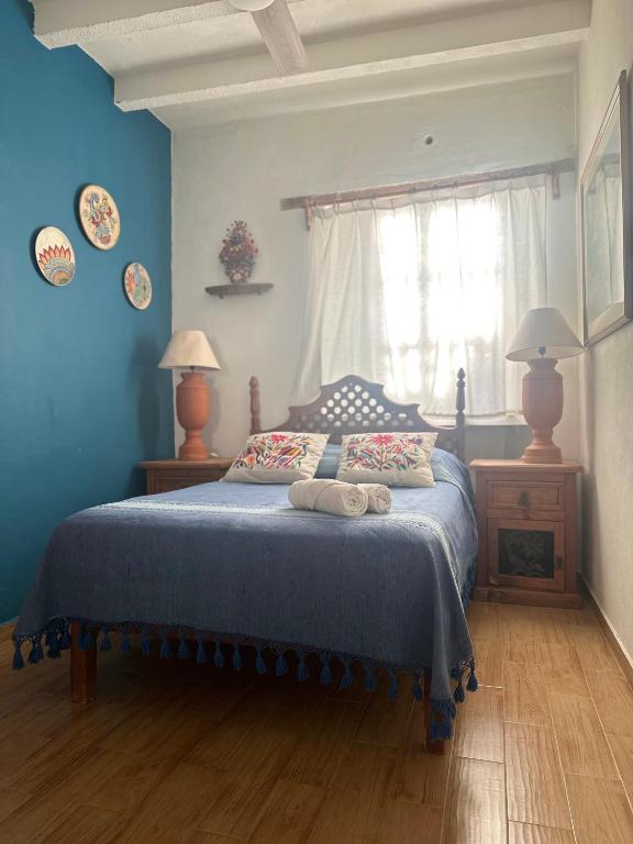 Postel nebo postele na pokoji v ubytování Casa Tecolote