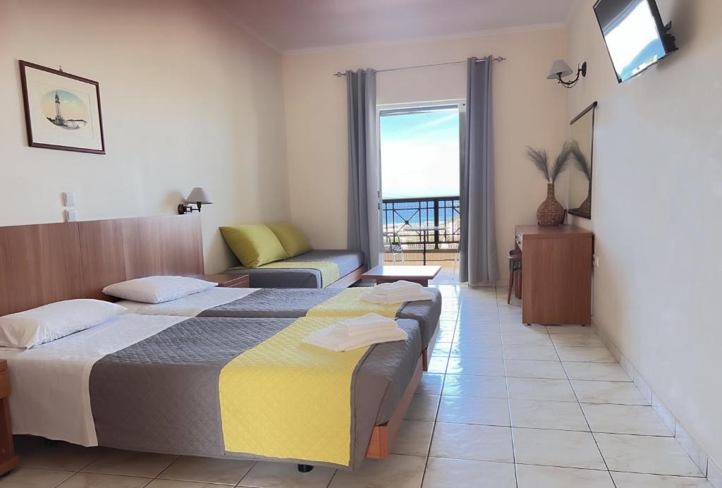 Postel nebo postele na pokoji v ubytování Ariadne Apartments