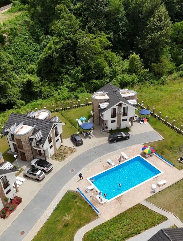 an aerial view of a house and a swimming pool at Crown TiM Villa in Vrnjačka Banja