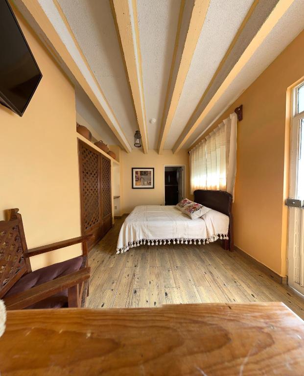 Postel nebo postele na pokoji v ubytování Casa Tecolote