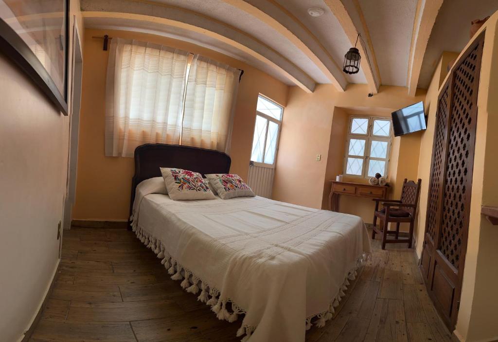 Postel nebo postele na pokoji v ubytování Casa Tecolote