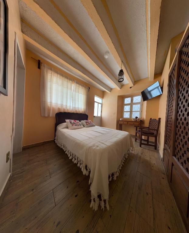 Postel nebo postele na pokoji v ubytování Casa Tecolote