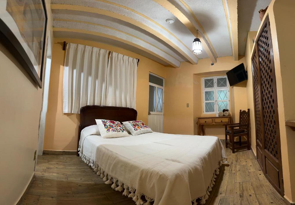 Postel nebo postele na pokoji v ubytování Casa Tecolote