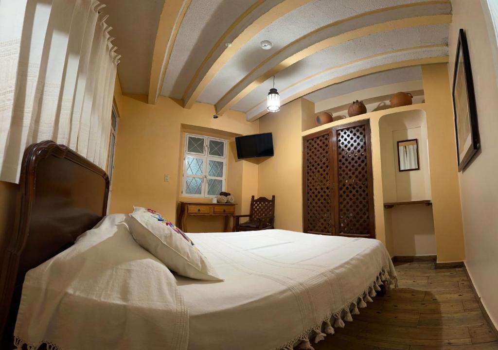 Postel nebo postele na pokoji v ubytování Casa Tecolote