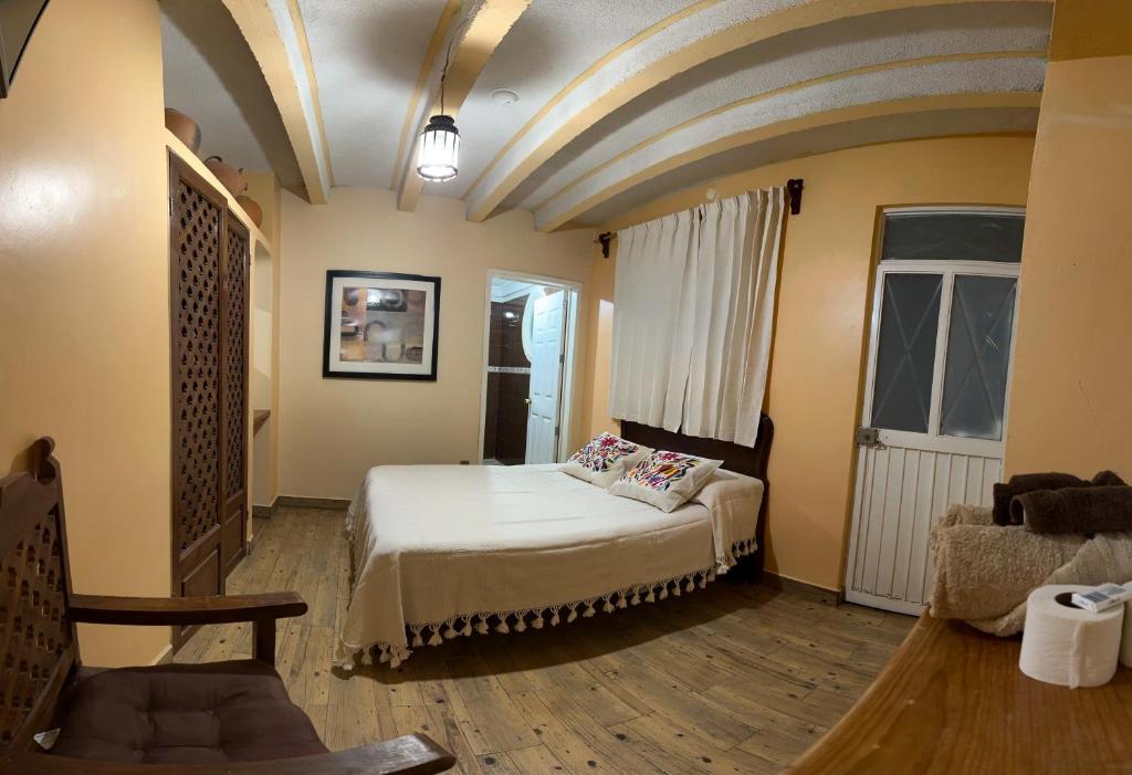 Postel nebo postele na pokoji v ubytování Casa Tecolote