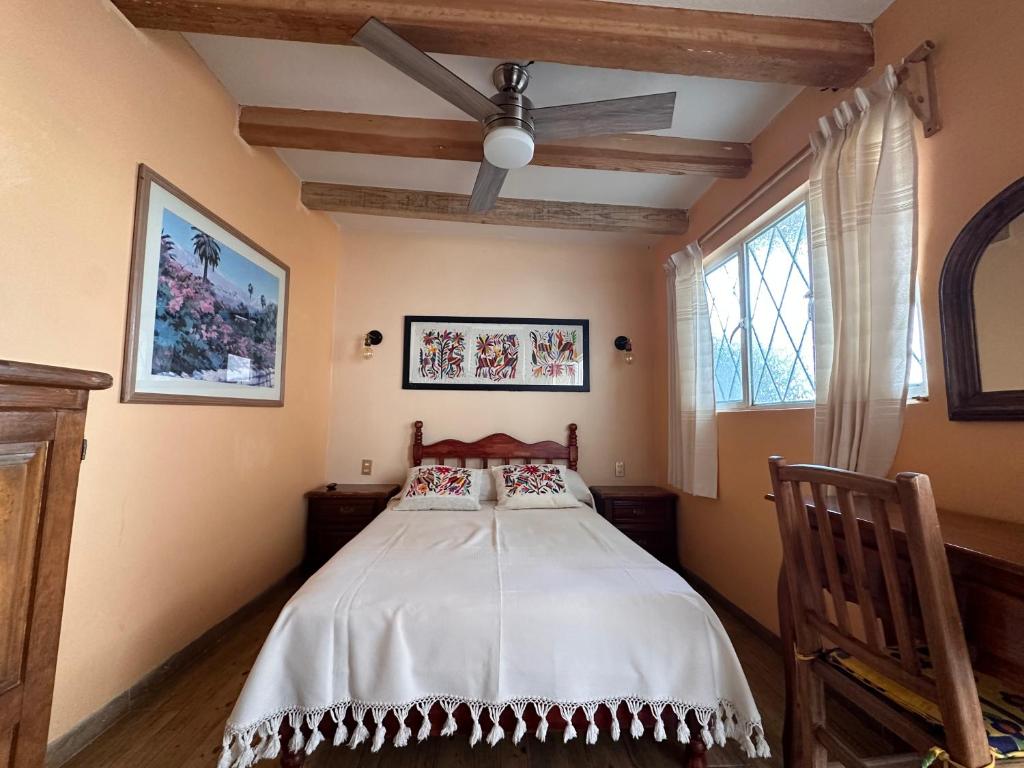 Postel nebo postele na pokoji v ubytování Casa Tecolote
