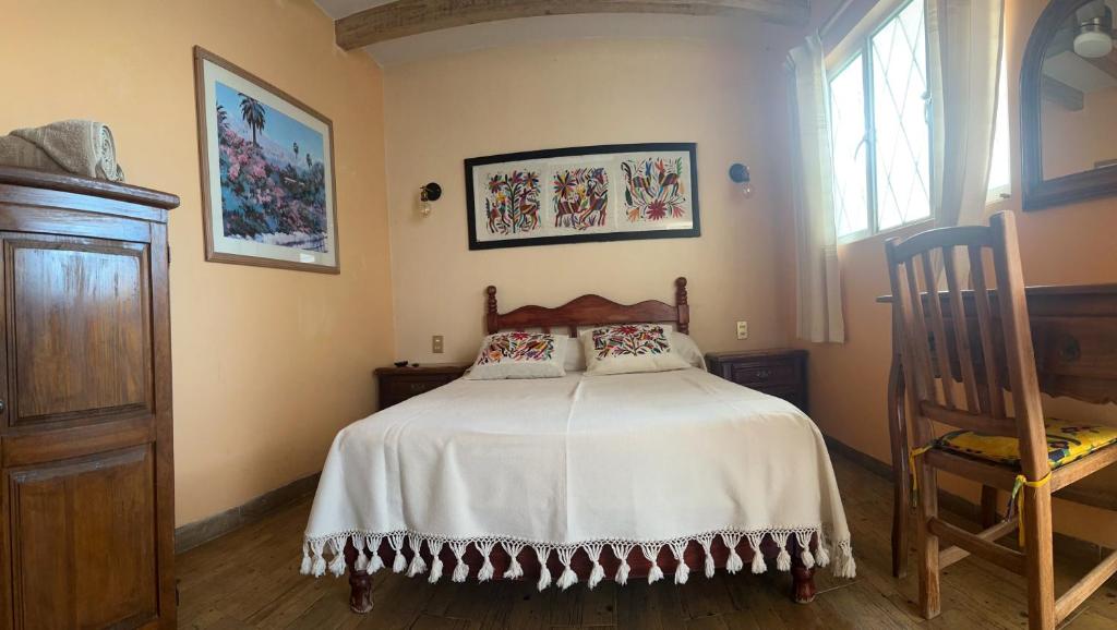 Postel nebo postele na pokoji v ubytování Casa Tecolote