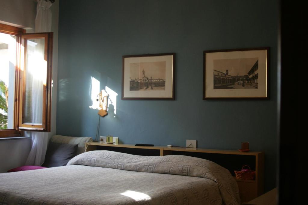 Postel nebo postele na pokoji v ubytování Albergo Villa Sorriso