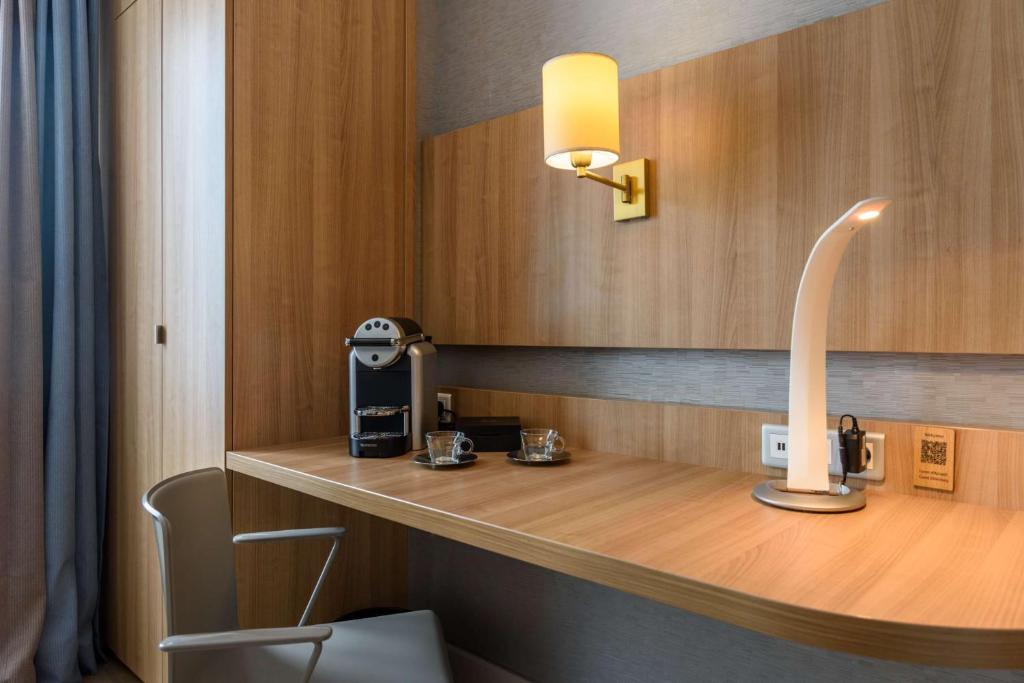 a room with a counter with a coffee maker on it at Best Western Plus Ajaccio Amirauté in Ajaccio