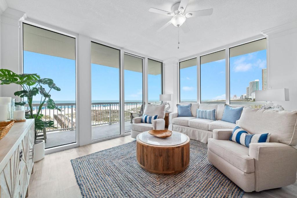 a living room with a couch and a table at Perdido Dunes Tower Unit 2W in Orange Beach
