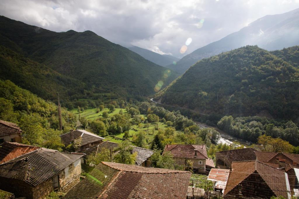 a view of a valley with mountains and houses at Radika View House in Galičnik