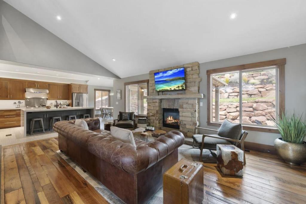 a living room with a couch and a fireplace at Heber Hideaway Exquisite Home with Hot Tub in Heber City