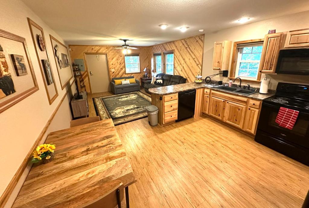 a kitchen with wooden cabinets and a counter top at The Barn in Asheville