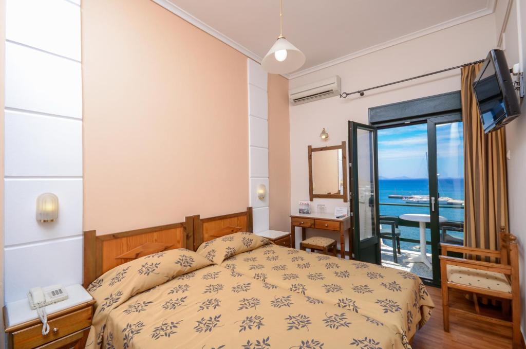Posteľ alebo postele v izbe v ubytovaní Hotel Coronis