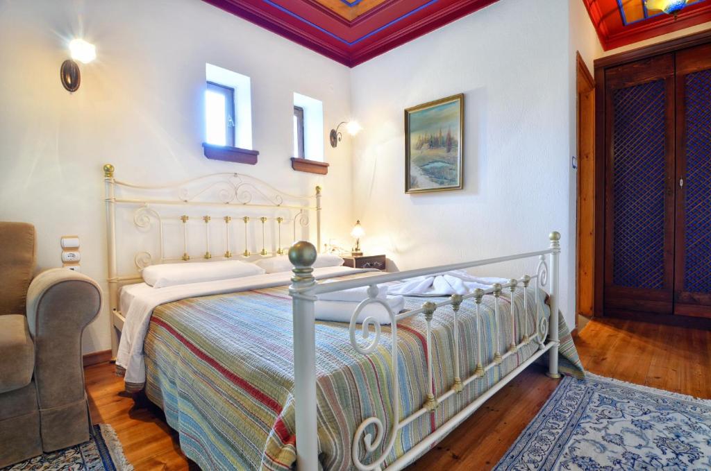 Postel nebo postele na pokoji v ubytování Melinas Boutique Hotel B&B