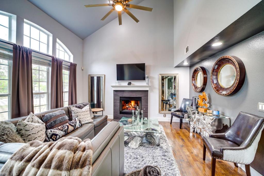a living room with a couch and a fireplace at Peace and Tranquility Home 2 Mi to Dtwn Tulsa! in Tulsa