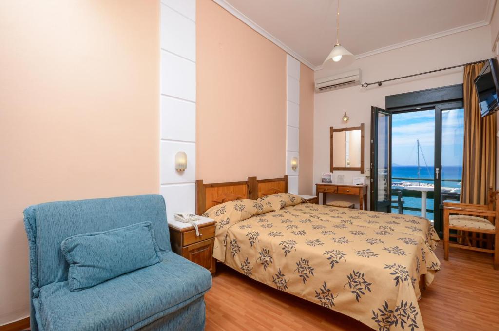 Posteľ alebo postele v izbe v ubytovaní Hotel Coronis